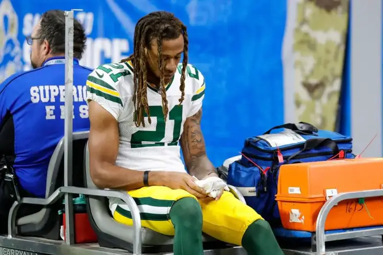 Green Bay Packers cornerback Eric Stokes (21) is carted off the field during the first half against Detroit Lions at Ford Field, Nov. 6, 2022.