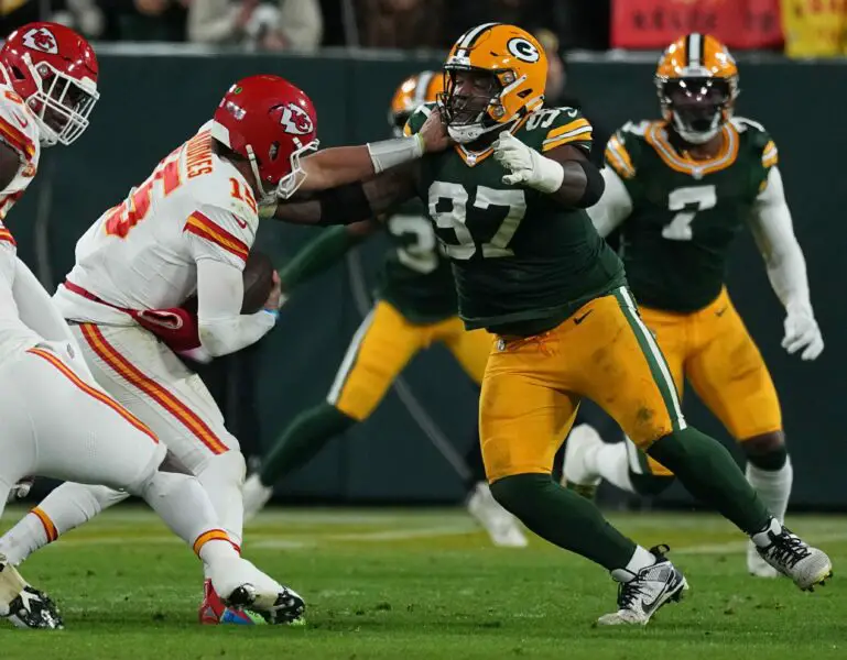 Green Bay Packers defensive tackle Kenny Clark (97) sacks Kansas City Chiefs quarterback Patrick Mahomes during the first quarter of their game Sunday, December 3, 2023 at Lambeau Field in Green Bay, Wisconsin.