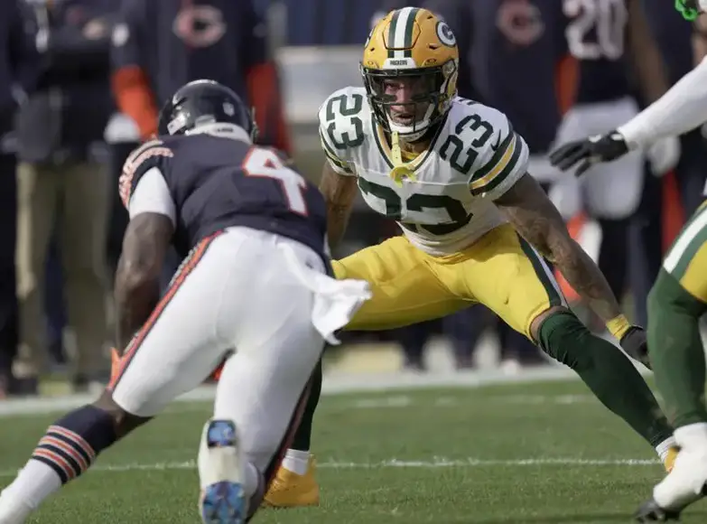 Nov 17, 2024; Chicago, Illinois, USA; Green Bay Packers cornerback Jaire Alexander (23) tackles Chicago Bears running back D'Andre Swift (4) during the first quarter of their game Sunday, November 17, 2024 at Soldier Field in Chicago, Illinois. Mandatory Credit: Mark Hoffman/USA TODAY Network via Imagn Images