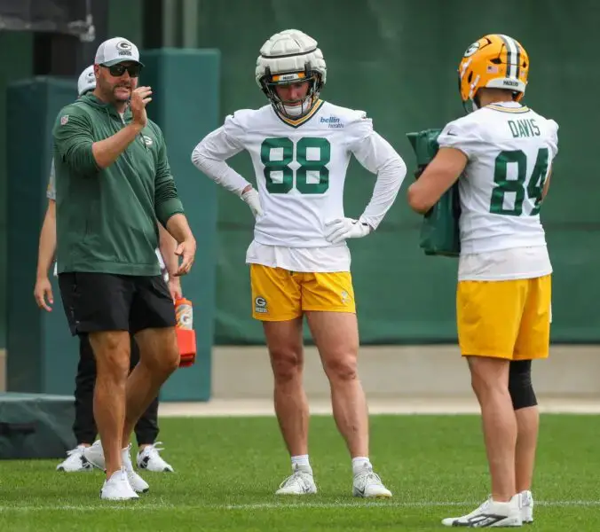 Green Bay Packers tight ends coach John Dunn gives instructions to Luke Musgrave (88) and Tyler Davis (84) in a drill during practice on Thursday, August 8, 2024, at Ray Nitschke Field in Ashwaubenon, Wis. Tork Mason/USA TODAY NETWORK-Wisconsin