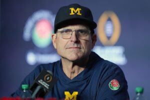 Suspicious Replay Has Washington Huskies Fans Call CFP National Championship 'Rigged' For Michigan 1 Washington Huskies, Michigan Wolverines, Jim Harbaugh