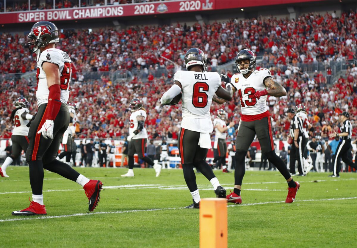 Jan 9, 2022; Tampa, Florida, USA; Tampa Bay Buccaneers running back Le'Veon Bell (6) is congratulated as he scores a touchdown  against the Carolina Panthers during the first half at Raymond James Stadium. Mandatory Credit: Kim Klement-USA TODAY Sports