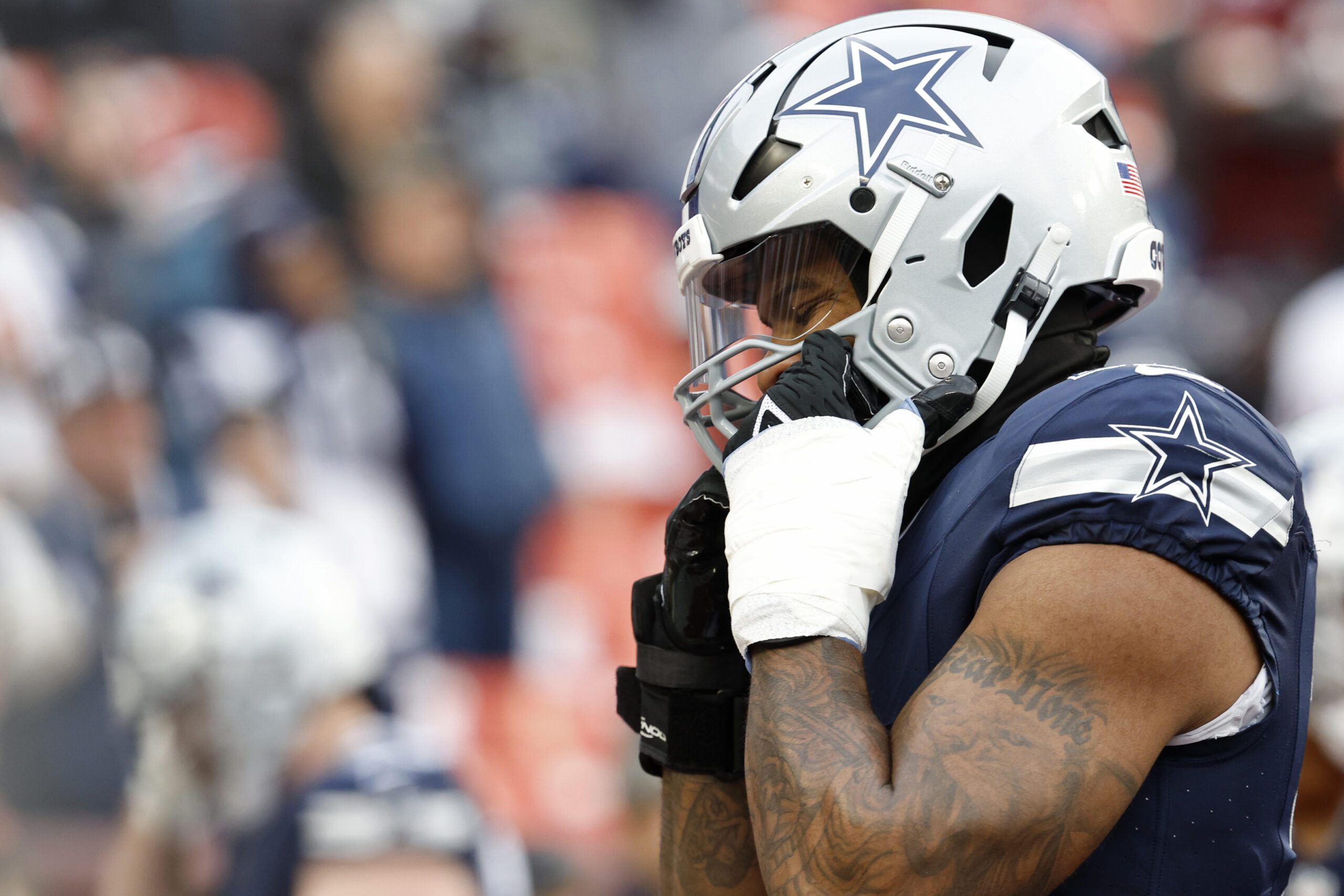 Jan 7, 2024; Landover, Maryland, USA; Dallas Cowboys linebacker Micah Parsons (11) adjusts his helmet during warmups prior to the game against the Washington Commanders at FedExField. Mandatory Credit: Geoff Burke-USA TODAY Sports