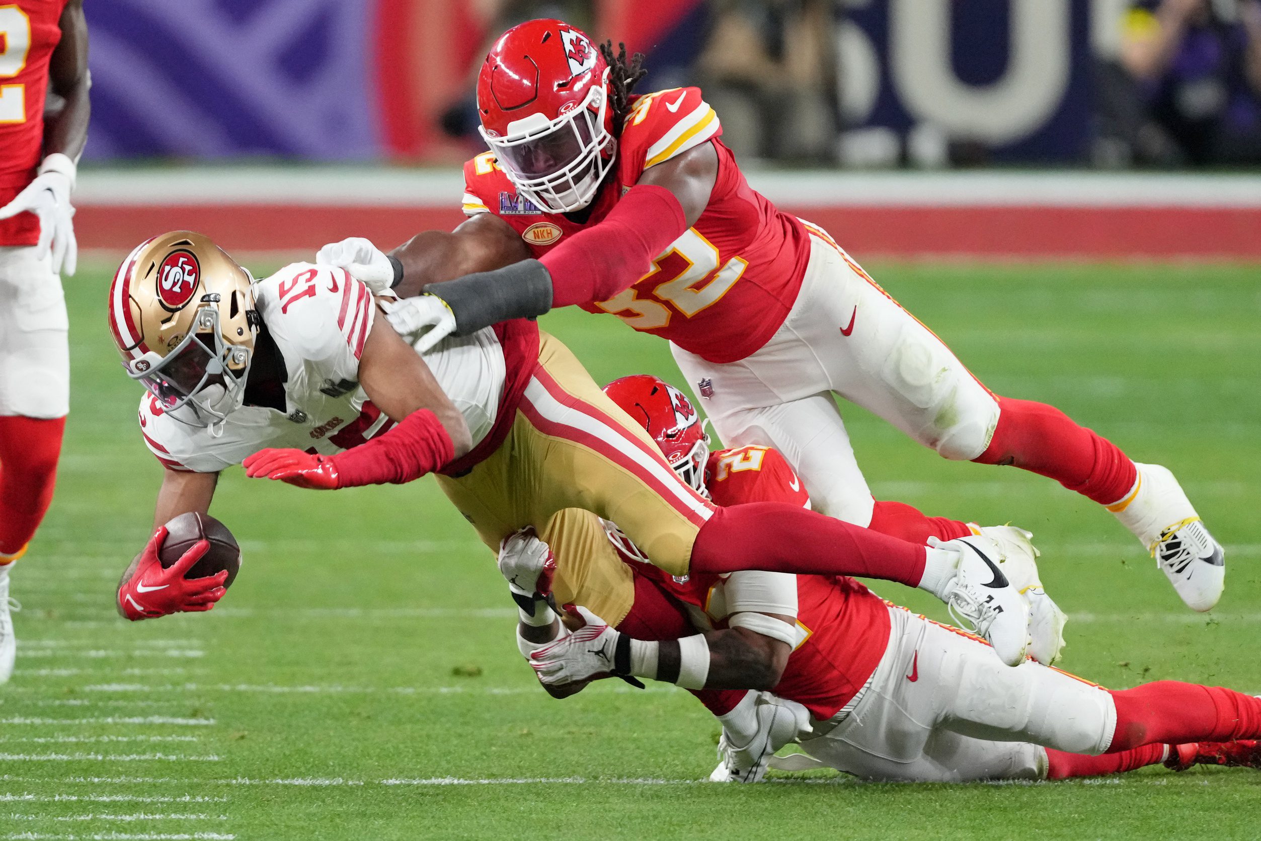 Feb 11, 2024; Paradise, Nevada, USA; Kansas City Chiefs safety Mike Edwards (21) and linebacker Nick Bolton (32) tackle San Francisco 49ers wide receiver Jauan Jennings (15) during the third quarter of Super Bowl LVIII at Allegiant Stadium. Mandatory Credit: Kyle Terada-USA TODAY Sports