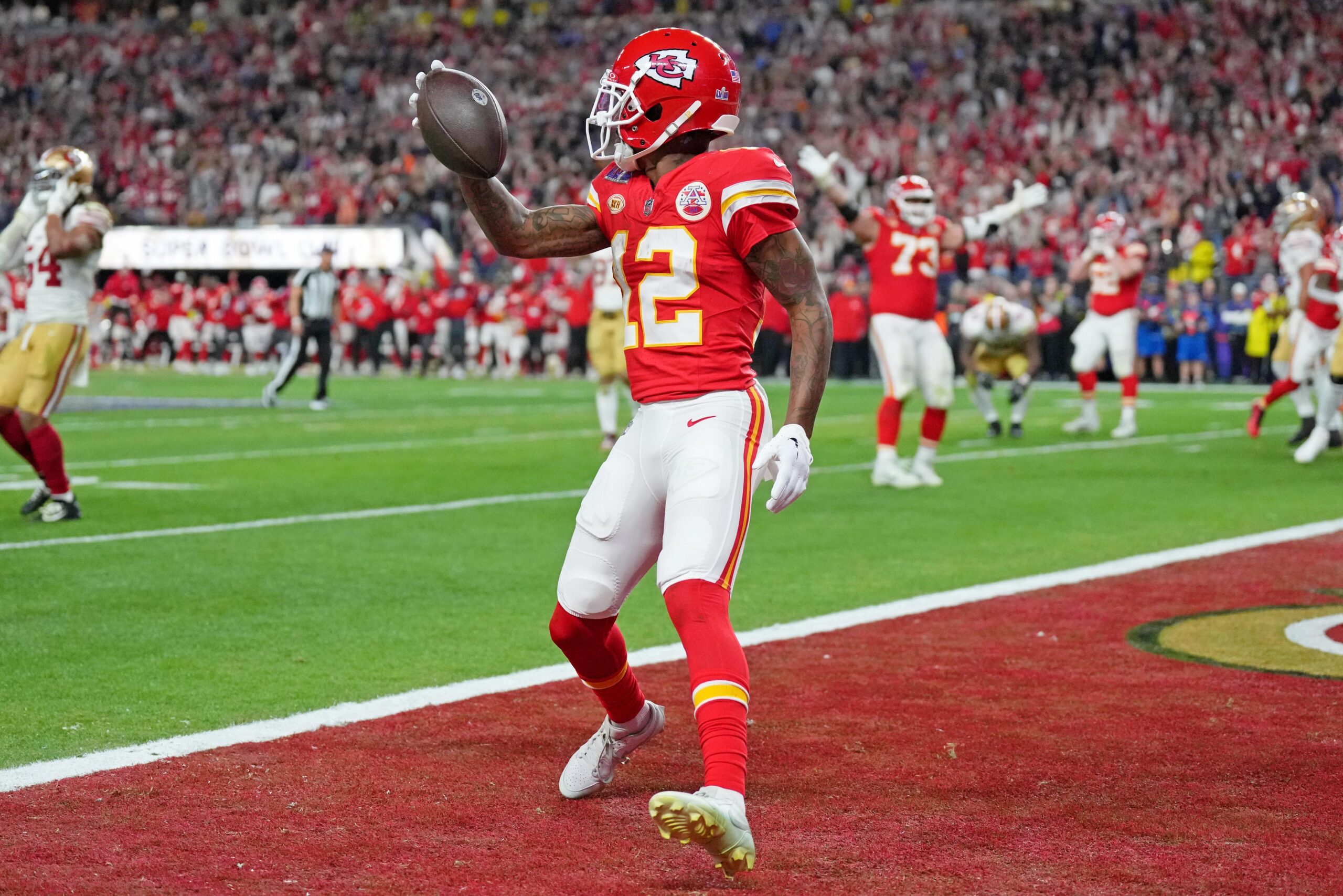 Feb 11, 2024; Paradise, Nevada, USA; Kansas City Chiefs wide receiver Mecole Hardman Jr. (12) reacts after scoring a touchdown against the San Francisco 49ers in overtime during Super Bowl LVIII at Allegiant Stadium. Mandatory Credit: Kirby Lee-USA TODAY Sports