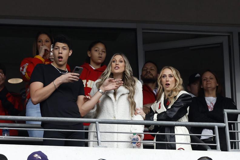 Jan 28, 2024; Baltimore, Maryland, USA; Jackson Mahomes (L) and Brittany Mahomes (R) watch from a suite during the game between the Kansas City Chiefs and Baltimore Ravens in the AFC Championship football game at M&T Bank Stadium. Mandatory Credit: Geoff Burke-Imagn Images