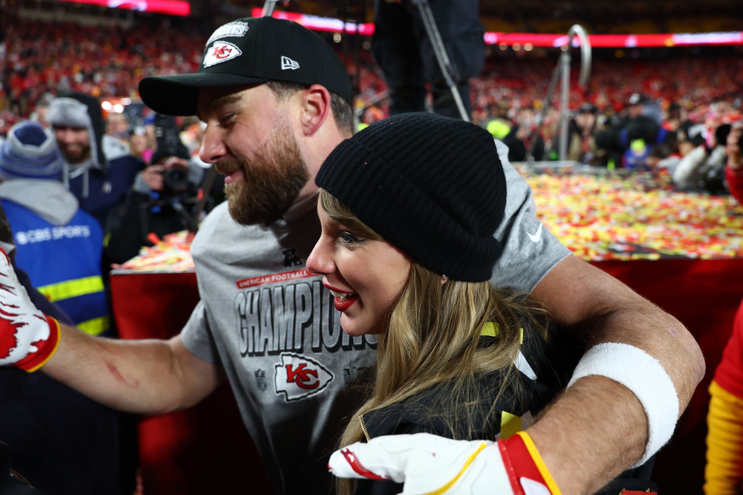 Jan 26, 2025; Kansas City, MO, USA; Recording artist Taylor Swift and Kansas City Chiefs tight end Travis Kelce (87) react after the AFC Championship game against the Buffalo Bills at GEHA Field at Arrowhead Stadium. Mandatory Credit: Mark J. Rebilas-Imagn Images