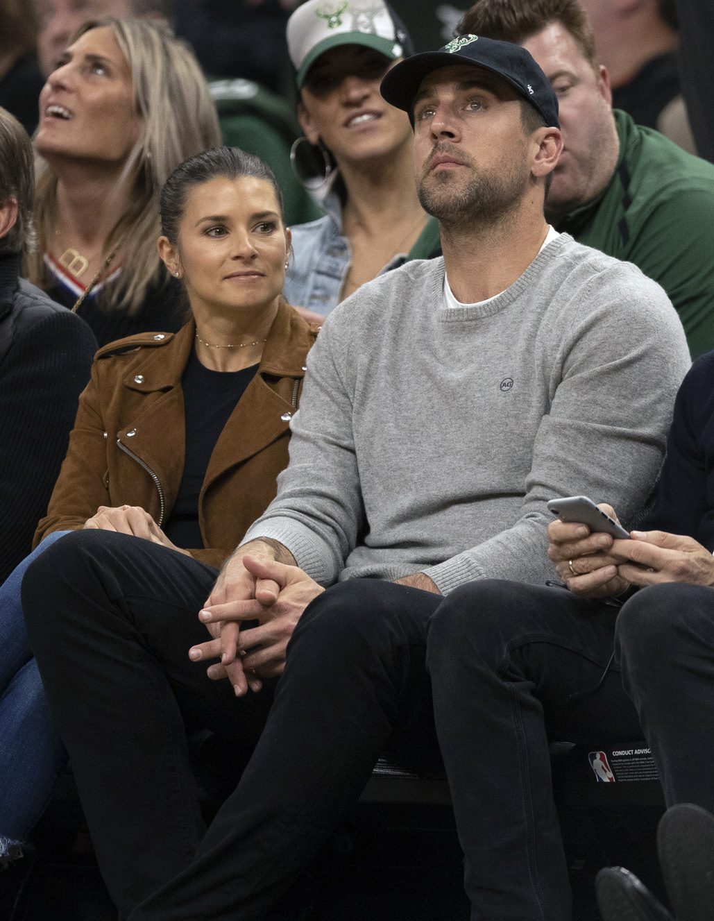 Apr 17, 2019; Milwaukee, WI, USA; Danica Patrick and Aaron Rodgers look on during the fourth quarter in game two of the first round of the 2019 NBA Playoffs between the Detroit Pistons and Milwaukee Bucks at Fiserv Forum. Mandatory Credit: Jeff Hanisch-Imagn Images Jets