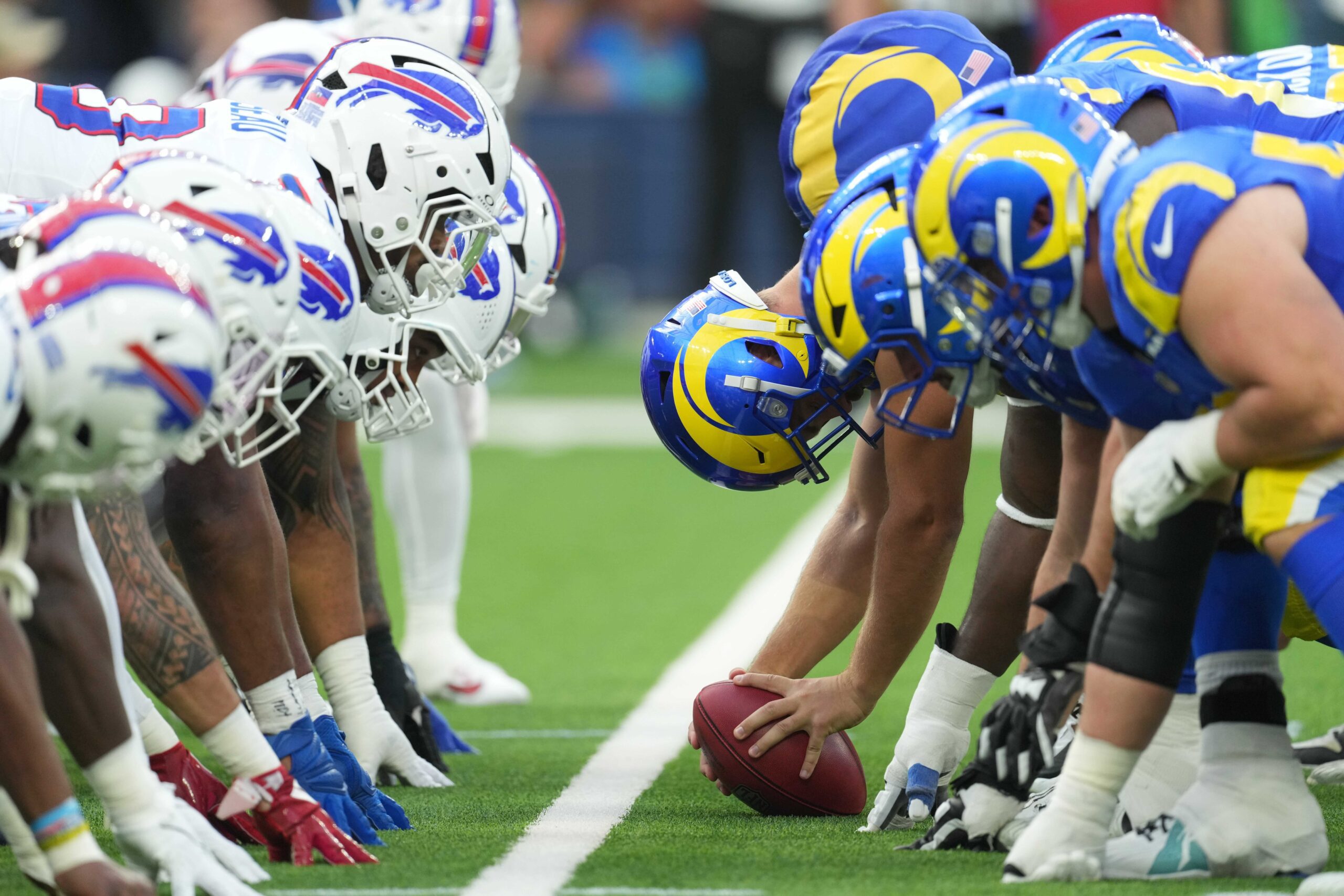 December 8, 2024; Inglewood, California, USA; Helmets along the brawl line, while Los Angeles Rams Long Strape Alex Ward (47) clicks the ball against Buffalo's accounts at Sophie Stadium. Required Credit: Kirby Lee-Imagn Images