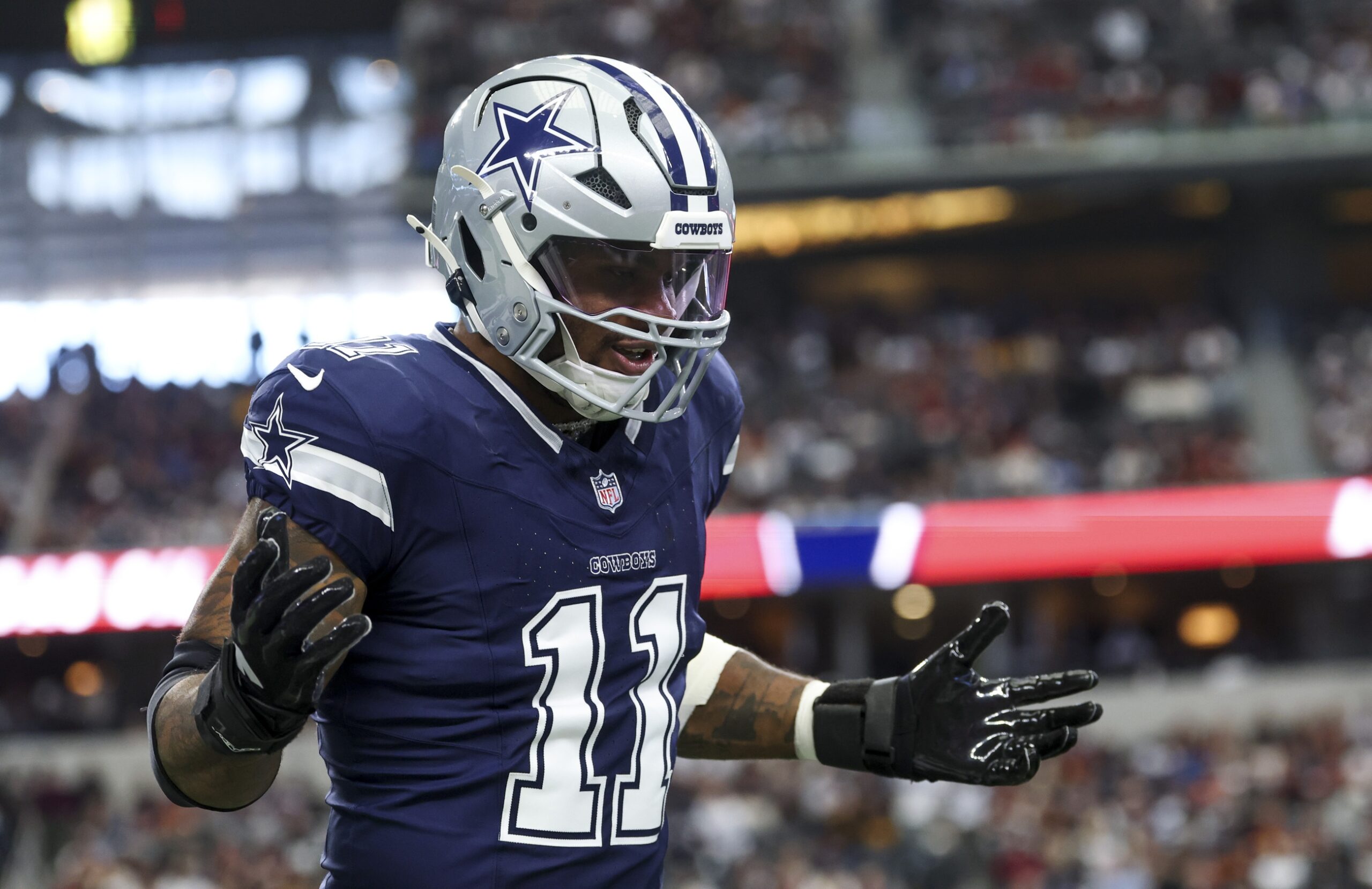 Jan 5, 2025; Arlington, Texas, USA; Dallas Cowboys linebacker Micah Parsons (11) celebrates after a sack during the first quarter against the Washington Commanders at AT&T Stadium. Mandatory Credit: Kevin Jairaj-Imagn Images