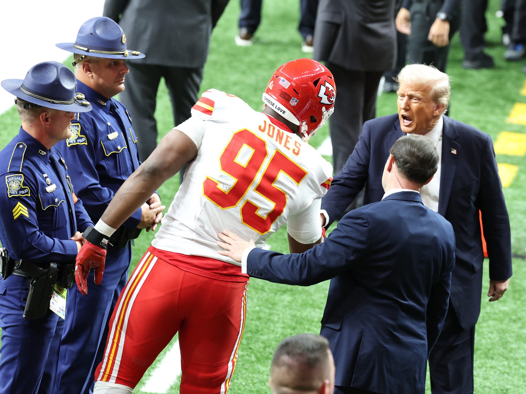 Feb 9, 2025; New Orleans, LA, USA; Kansas City Chiefs defensive tackle Chris Jones (95) greets President Donald Trump before playing against the Philadelphia Eagles in Super Bowl LIX at Ceasars Superdome. Mandatory Credit: Stephen Lew-Imagn Images