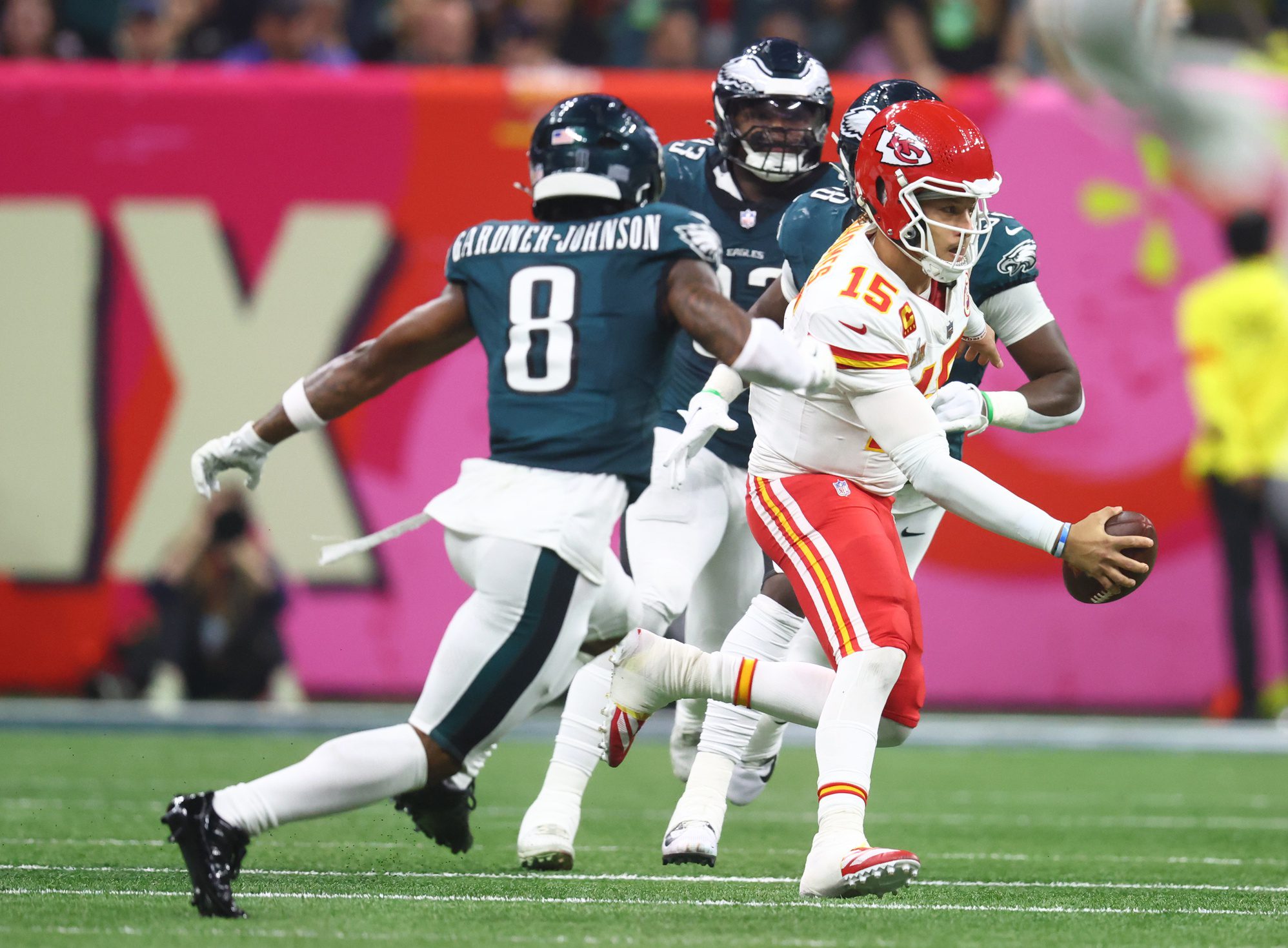 Feb 9, 2025; New Orleans, LA, USA; Kansas City Chiefs quarterback Patrick Mahomes (15) is chased by Philadelphia Eagles safety C.J. Gardner-Johnson (8) in Super Bowl LIX between the Philadelphia Eagles and the Kansas City Chiefs at Ceasars Superdome. Mandatory Credit: Mark J. Rebilas-Imagn Images