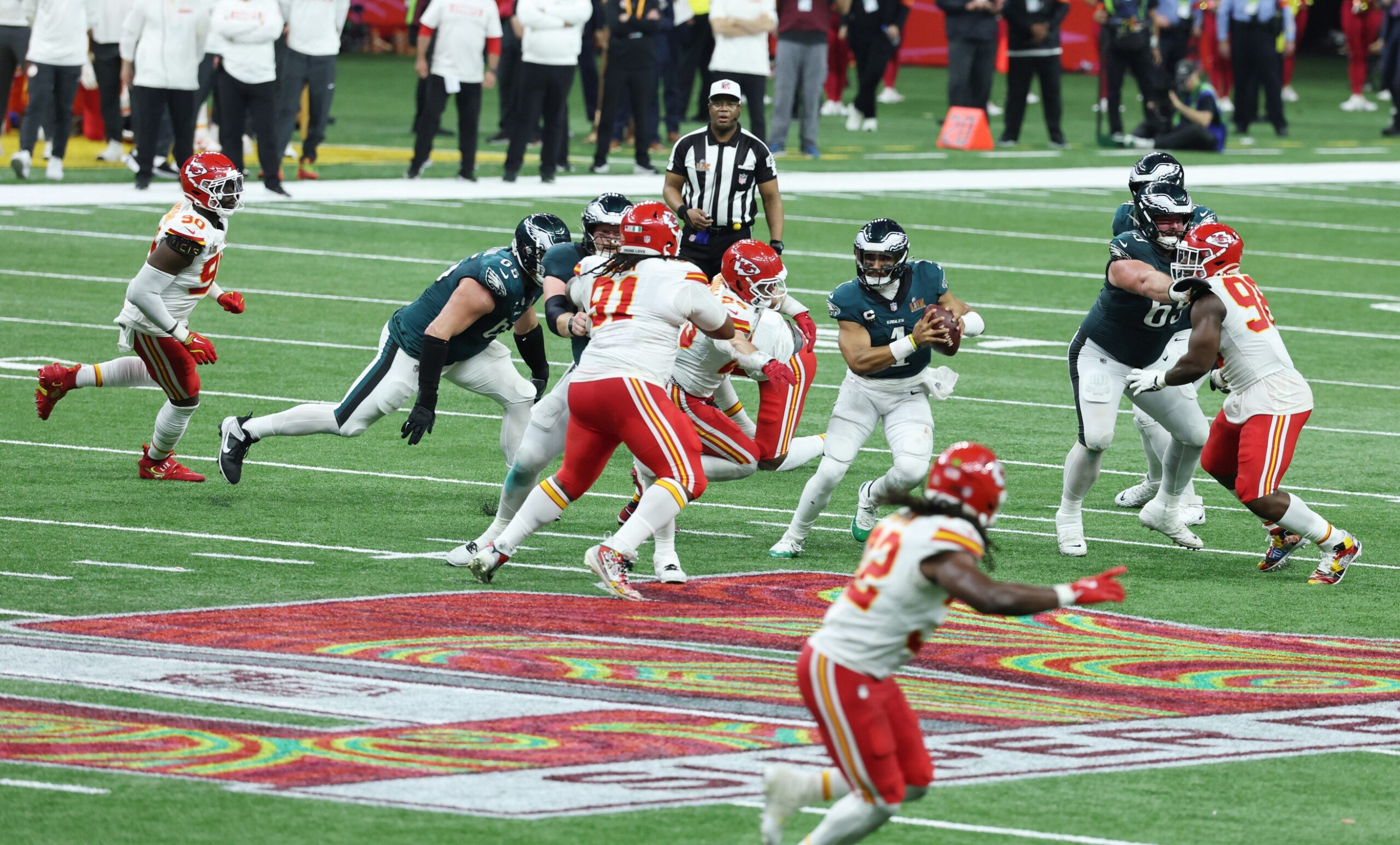 Feb 9, 2025; New Orleans, LA, USA;  Philadelphia Eagles quarterback Jalen Hurts (1) scrambles against the Kansas City Chiefs in the fourth quarter in Super Bowl LIX at Ceasars Superdome. Mandatory Credit: Stephen Lew-Imagn Images