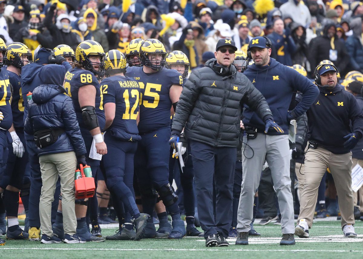 Michigan Wolverines head coach Jim Harbaugh, center, speaks with quarterbacks coach Matt Weiss, right, during action against the Ohio State Buckeyes on Saturday, Nov. 27, 2021 at Michigan Stadium. © Kirthmon F. Dozier / USA TODAY NETWORK