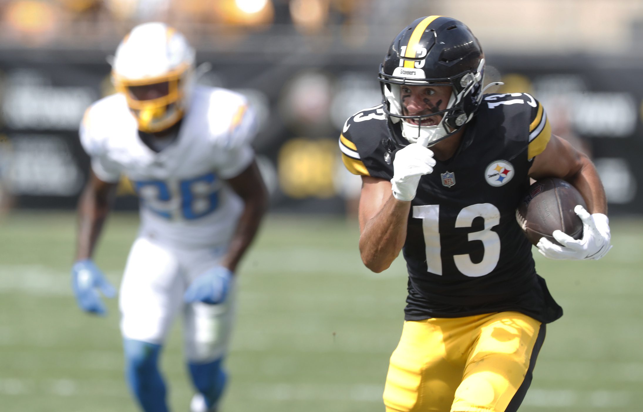 Sep 22, 2024; Pittsburgh, Pennsylvania, USA; Pittsburgh Steelers wide receiver Scotty Miller (13) runs after a pass reception against the Los Angeles Chargers during the second quarter at Acrisure Stadium. Mandatory Credit: Charles LeClaire-Imagn Images