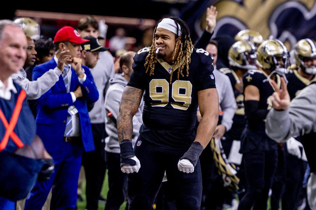 Dec 15, 2024; New Orleans, Louisiana, USA; New Orleans Saints defensive end Chase Young (99) reacts to a score against the Washington Commanders during the second half at Caesars Superdome. Mandatory Credit: Stephen Lew-Imagn Images