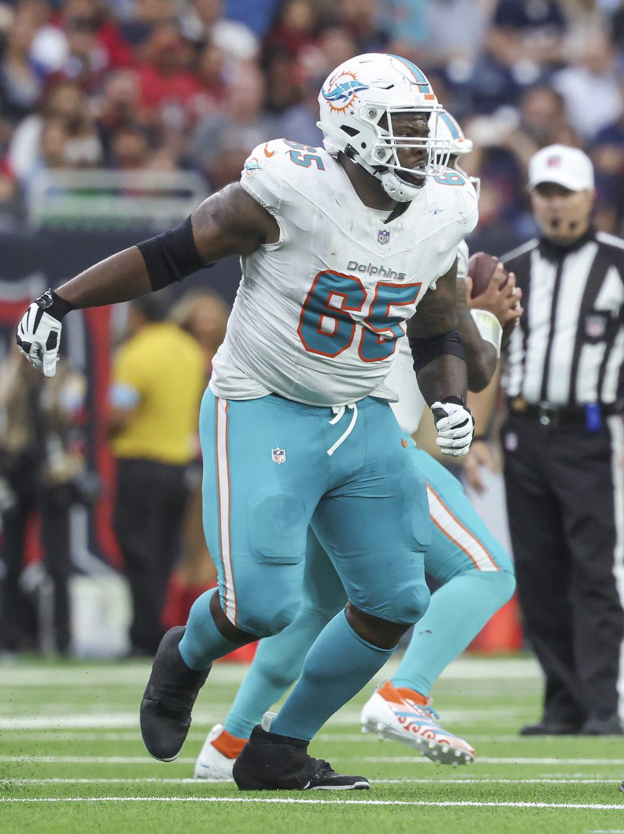 Dec 15, 2024; Houston, Texas, USA; Miami Dolphins guard Robert Jones (65) in action during the game against the Houston Texans at NRG Stadium. Mandatory Credit: Troy Taormina-Imagn Images