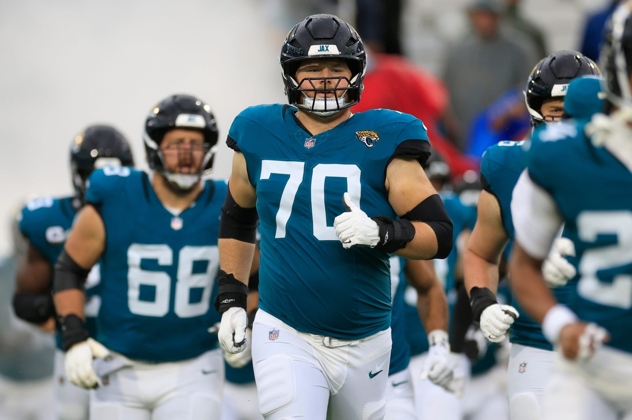 Jacksonville Jaguars offensive tackle Cole Van Lanen (70) runs on the field before an NFL football matchup Sunday, Dec. 29, 2024 at EverBank Stadium in Jacksonville, Fla. The Jaguars held off the Titans 20-13. [Corey Perrine/Florida Times-Union]Packers