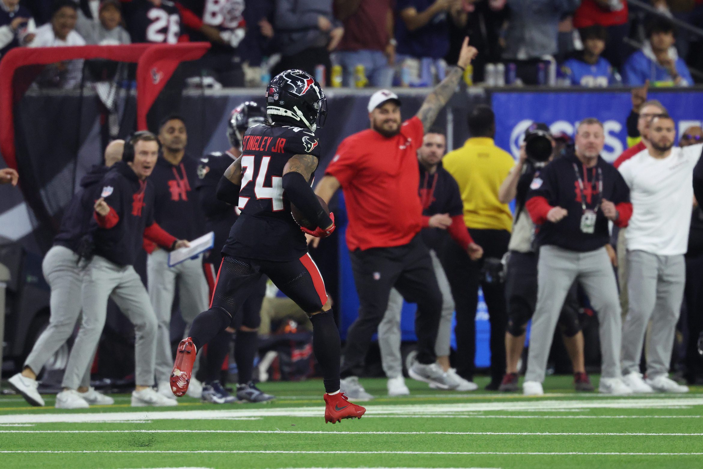 Jan 11, 2025; Houston, Texas, USA; Houston Texans corner back Derek Stingley Jr. (24) runs the ball during the third quarter after an interception against the Los Angeles Chargers in an AFC wild card game at NRG Stadium. Mandatory Credit: Troy Taormina-Imagn Images