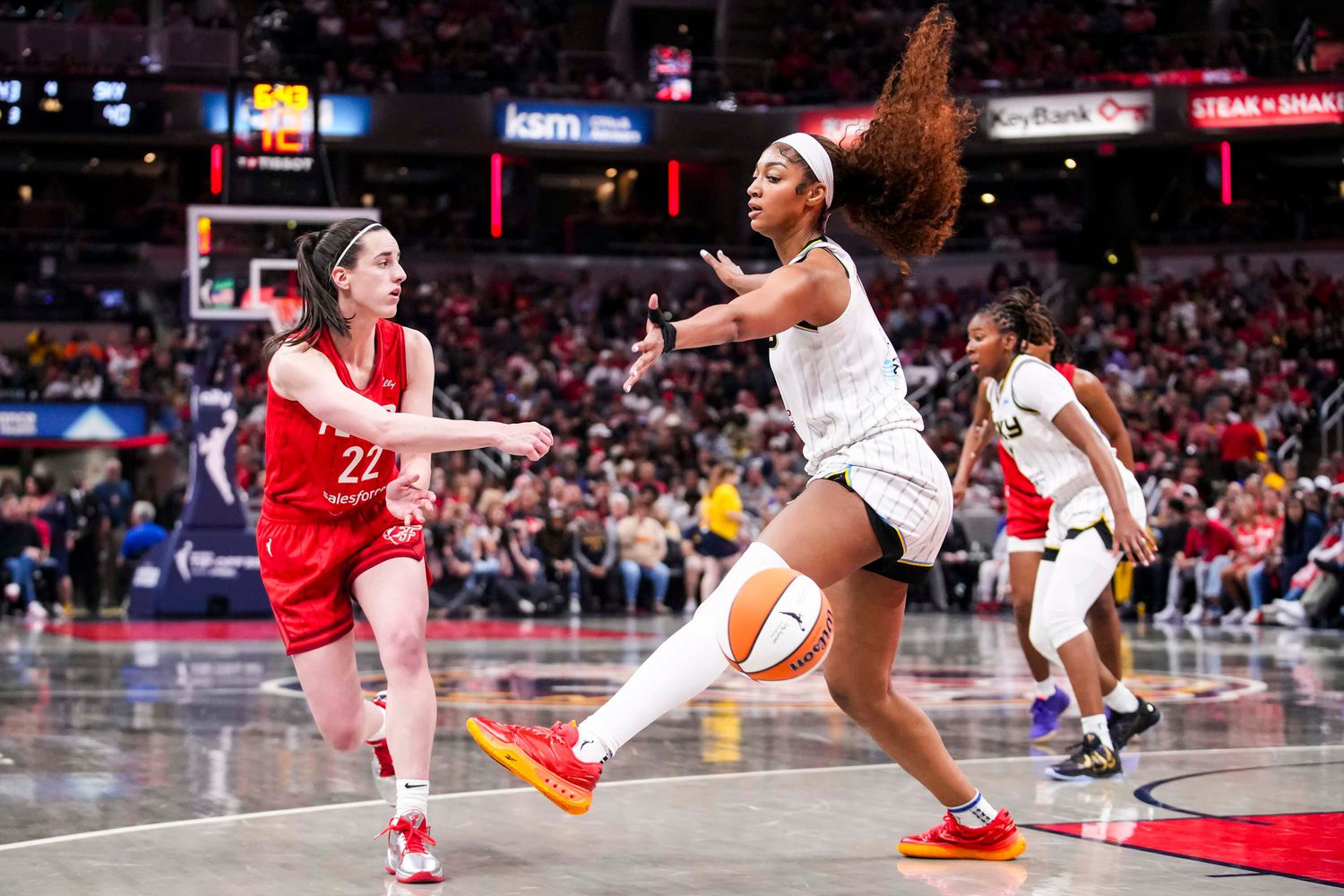 "I Don't Respect It, Respectfully": Caitlin Clark, Angel Reese Hot Take By RGIII Gets Dez Bryant Irked, Gives Him A Piece Of His Mind 3 Indiana Fever guard Caitlin Clark (22) passes around Chicago Sky forward Angel Reese (5) on Saturday, May 17, 2025, during a game between the Indiana Fever and the Chicago Sky at Gainbridge Fieldhouse in Indianapolis. The Indiana Fever defeated the Chicago Sky, 93-58. © Grace Smith/IndyStar / USA TODAY NETWORK via Imagn Images