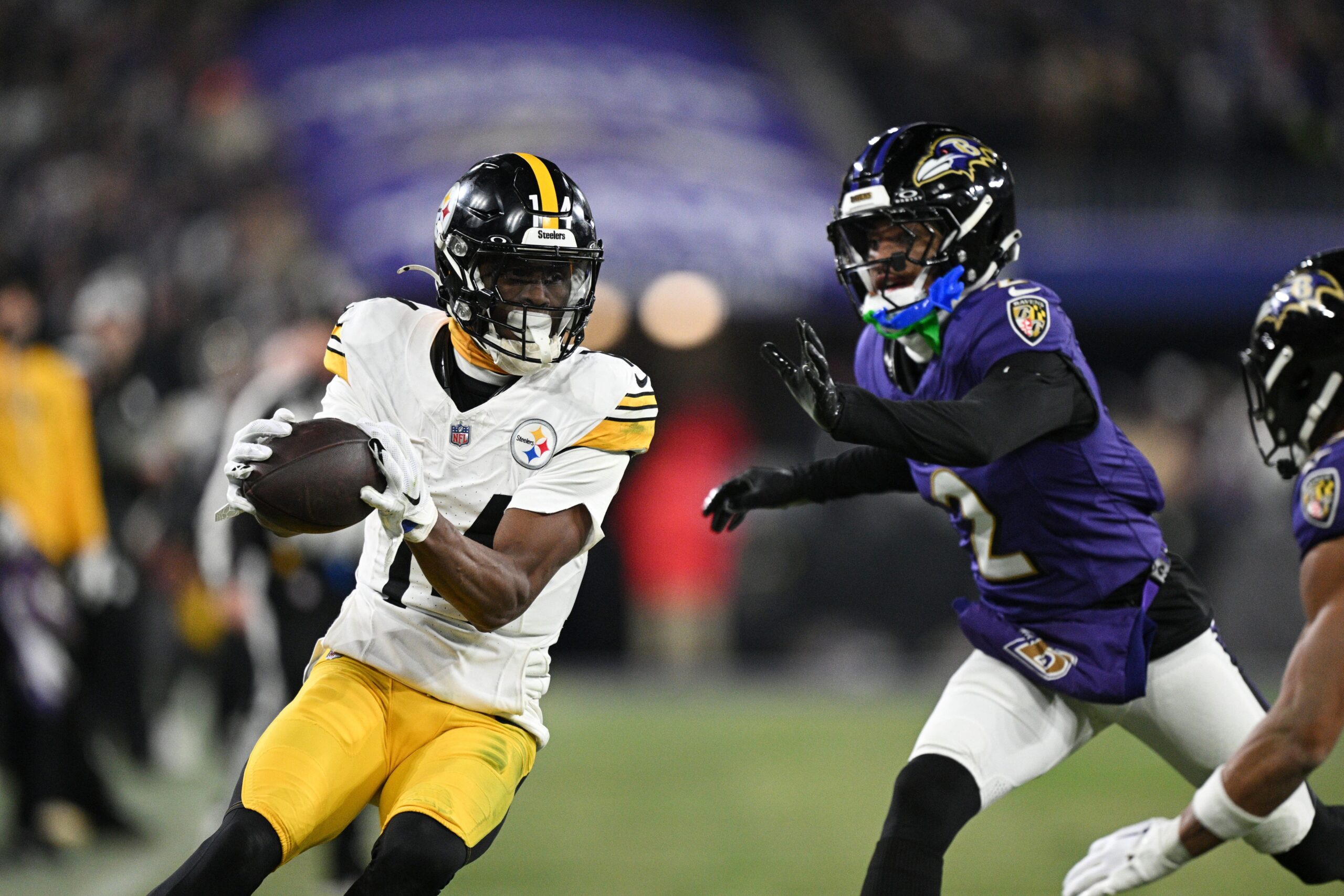 Jan 11, 2025; Baltimore, Maryland, USA; Pittsburgh Steelers wide receiver George Pickens (14) makes a catch against Baltimore Ravens cornerback Nate Wiggins (2) in the third quarter in an AFC wild card game at M&T Bank Stadium. Mandatory Credit: Tommy Gilligan-Imagn Images Cowboys