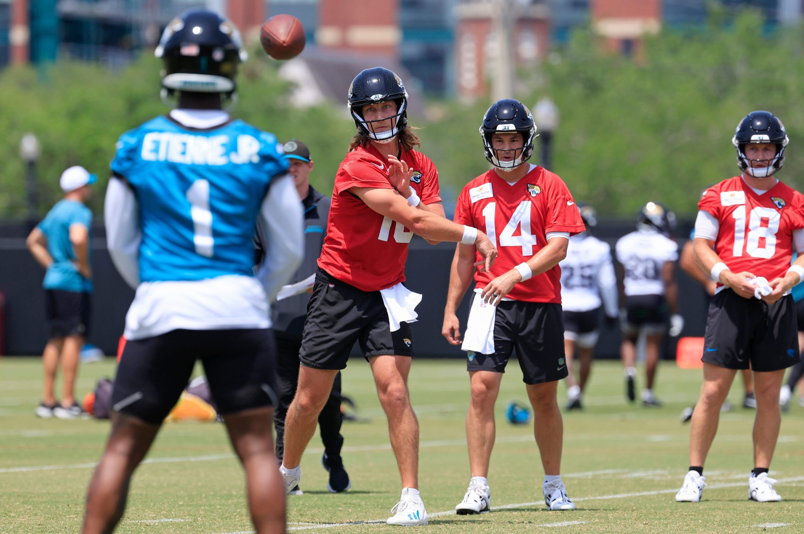 Carolina Panthers Rookie RB Reveals Plan While Behind Chuba Hubbard, Rico Dowdle on Depth Chart 1 Jacksonville Jaguars quarterback Trevor Lawrence (16) throws the ball to running back Travis Etienne Jr. (1)
