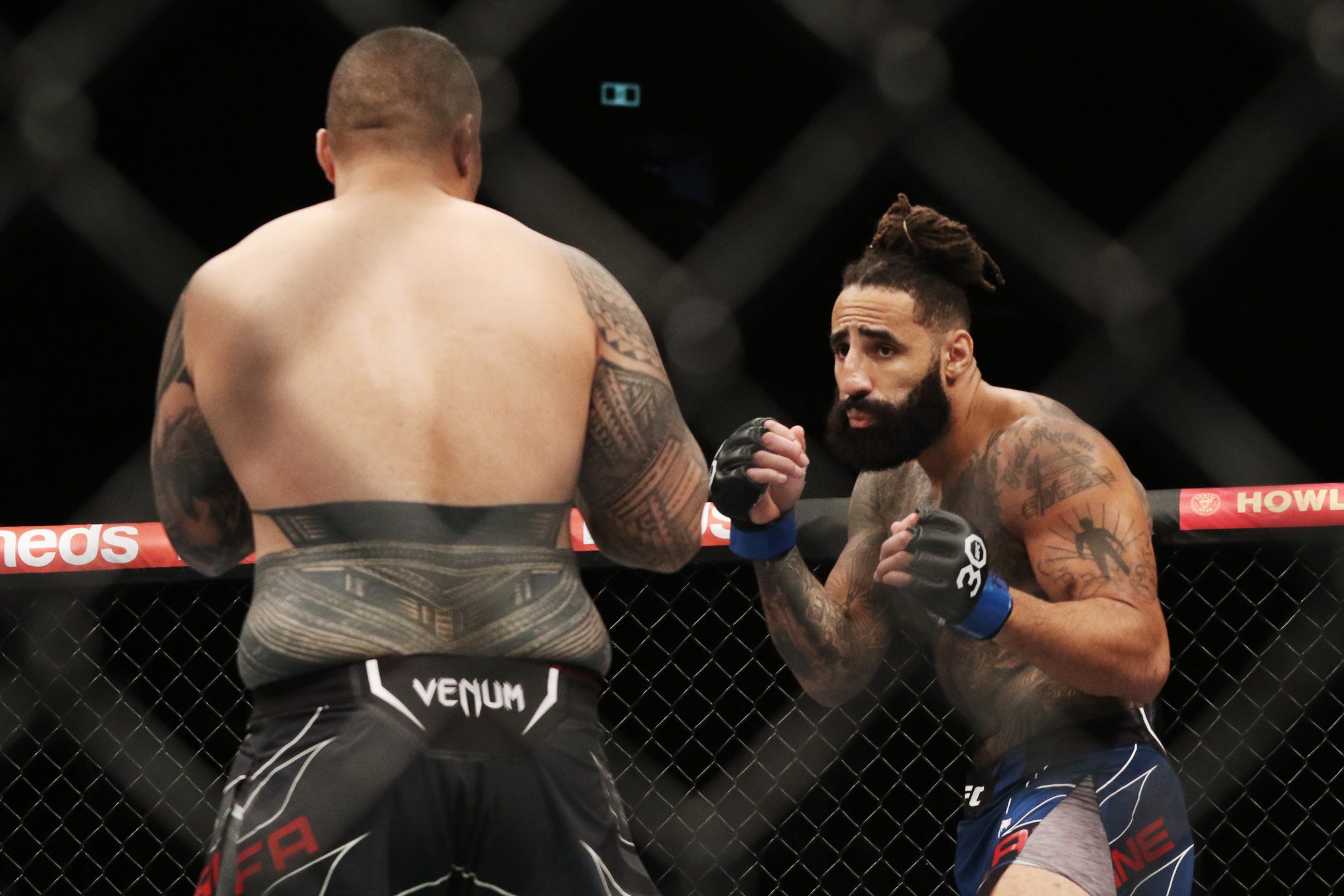 Former NFL Star Sees UFC Career Go Up In Flames After Embarrassing Loss (Watch) 1 Sep 9, 2023; Sydney, NSW, AUSTRALIA; Justin Tafa (red gloves) fights Austen Lane (blue gloves) during UFC 293 at Qudos Bank Arena. Mandatory Credit: Jasmin Frank-USA TODAY Sports NFL
