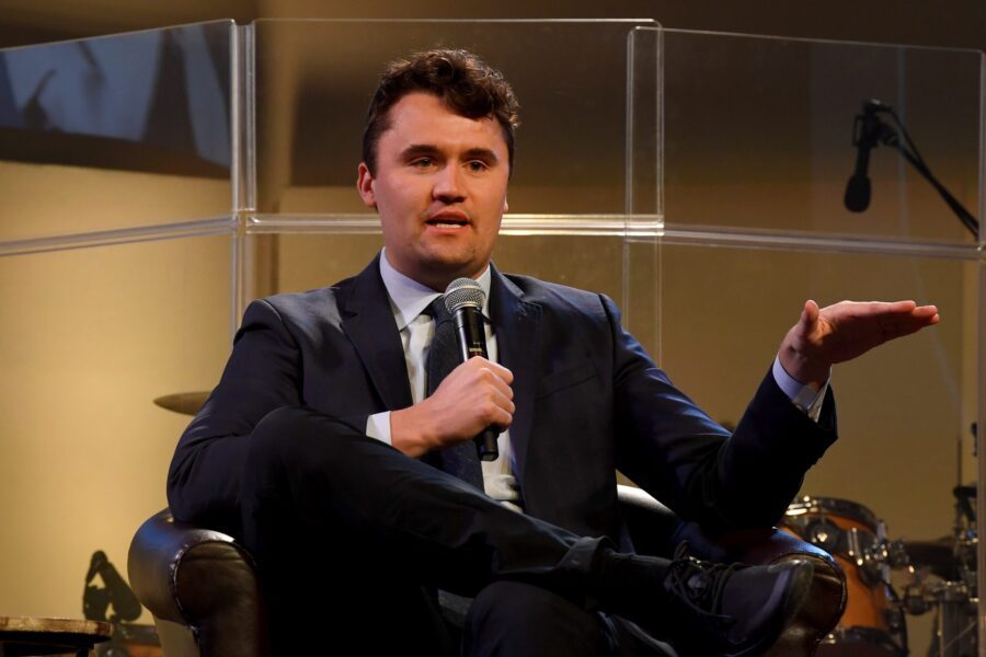 Turning Point USA President Charlie Kirk addresses the audience as he sits with Godspeak Calvary Chapel Pastor Rob McCoy in front of a capacity crowd in Newbury Park