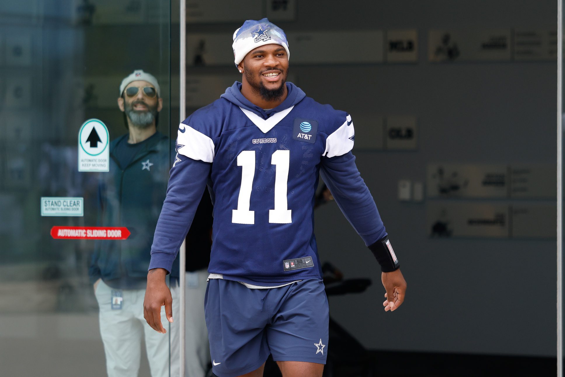 Jun 10, 2025; Arlington, TX, USA; Dallas Cowboys defensive end Micah Parsons (11) walks onto the practice field at the Ford Center at the Star Training Facility in Frisco, Texas. Mandatory Credit: Chris Jones-Imagn Images