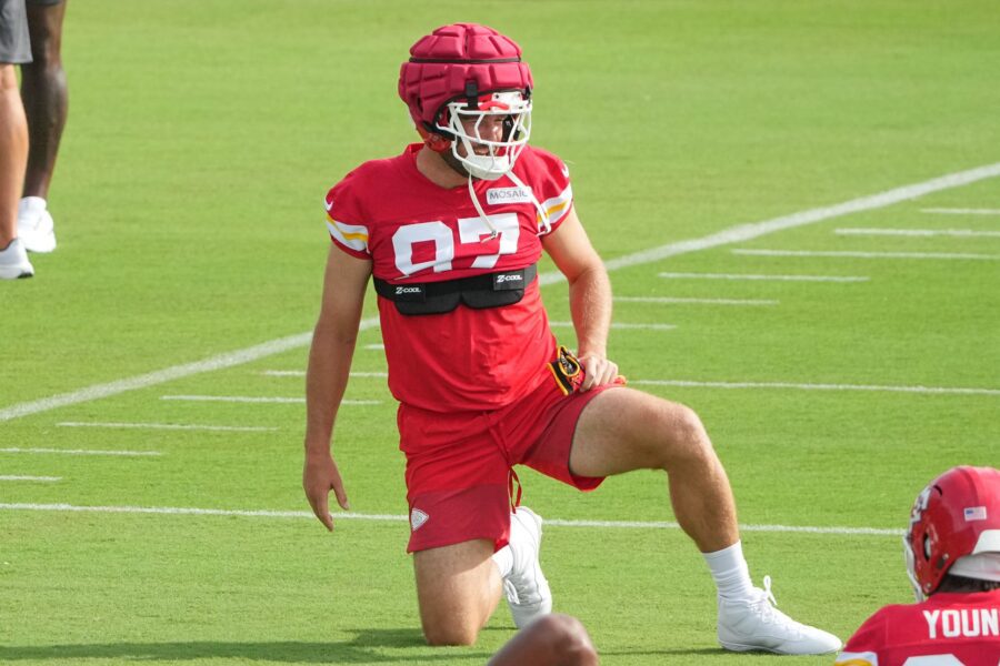 Jul 22, 2025; St. Joseph, MO, USA; Kansas City Chiefs tight end Travis Kelce (87) stretches out during training camp at Missouri Western State University. Mandatory Credit: Denny Medley-Imagn Images