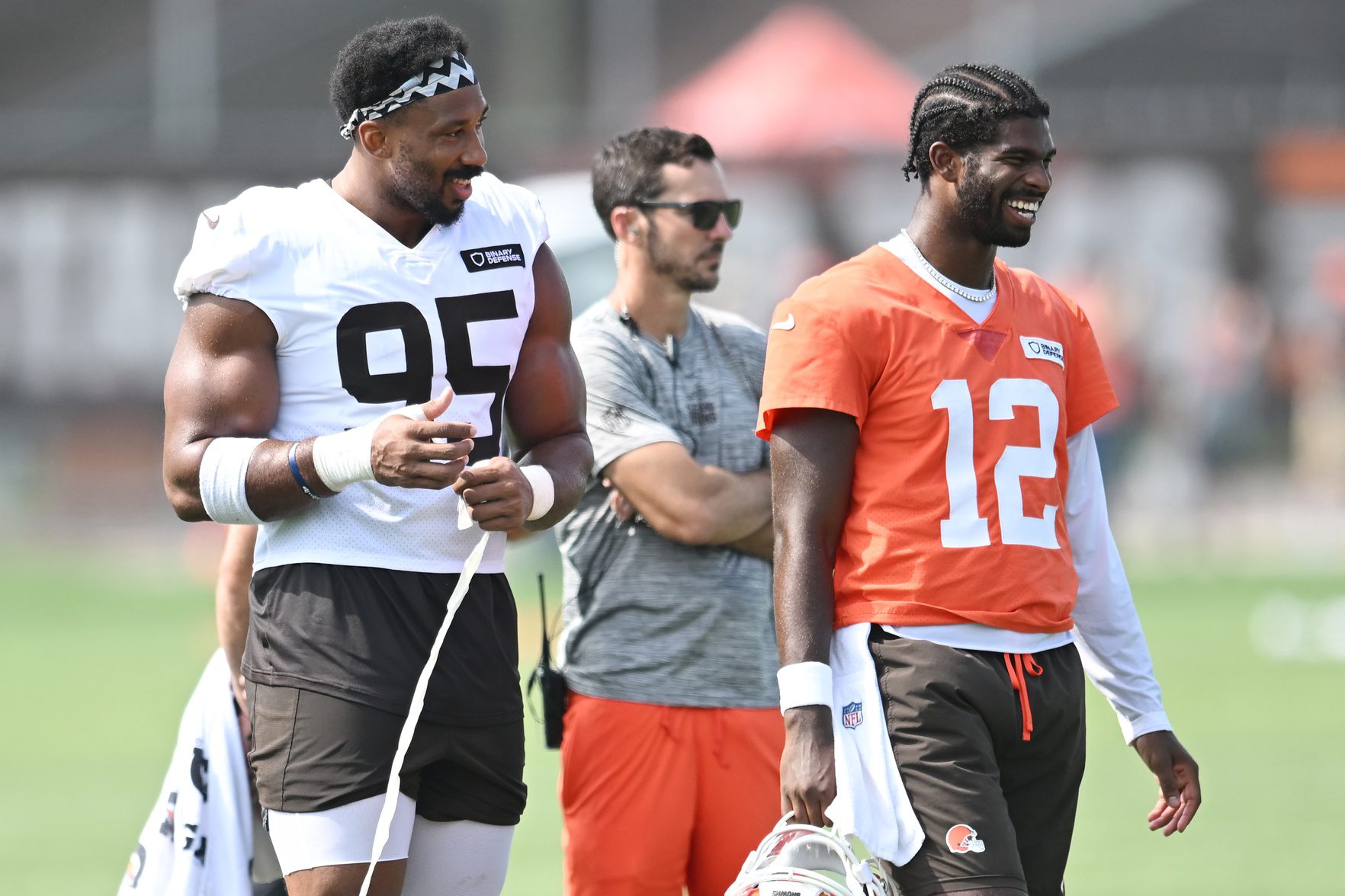 Jul 26, 2025; Berea, OH, USA; Cleveland Browns defensive end Myles Garrett (95) talks to quarterback Shedeur Sanders (12) during training camp at CrossCountry Mortgage Campus. Mandatory Credit: Ken Blaze-Imagn Images