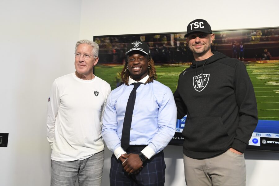 Ashton Jeanty steals the show at NBA Summer League in Vegas 1 Apr 25, 2025; Henderson, NV, USA; (L-R) Las Vegas Raiders head coach Pete Carroll, Ashton Jeanty and general manager John Spytek pose after a news conference introducing Jeanty as the first round draft pick in the 2025 NFL Draft at Intermountain Health Performance Center. Mandatory Credit: Candice Ward-Imagn Images