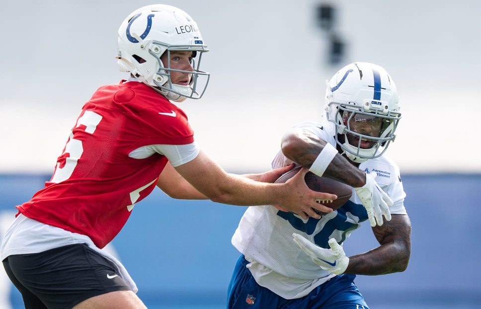 Indianapolis Colts quarterback Riley Leonard (15) hands off Friday, July 25, 2025, to running back Salvon Ahmed (36) during training camp held at Grand Park in Westfield. © Mykal McEldowney/IndyStar / USA TODAY NETWORK via Imagn Images