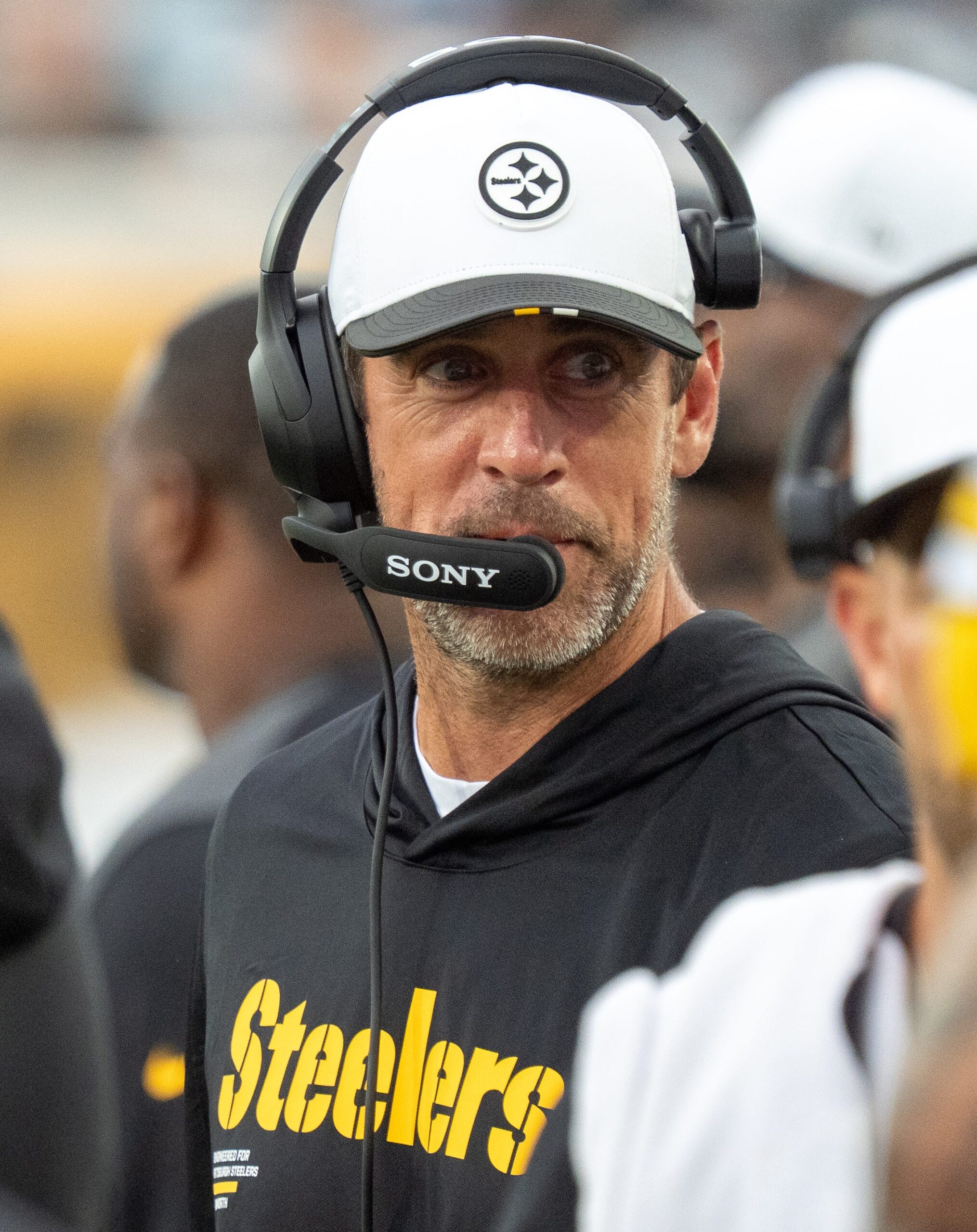 Pittsburgh Steelers quarterback Aaron Rodgers (8) walks along the sideline with a headset during the first half of the first preseason game where the Jacksonville Jaguars hosted the Pittsburgh Steelers Saturday Aug. 9, 2025, at EverBank Stadium in Jacksonville, Fla. [Doug Engle/Florida Times-Union]