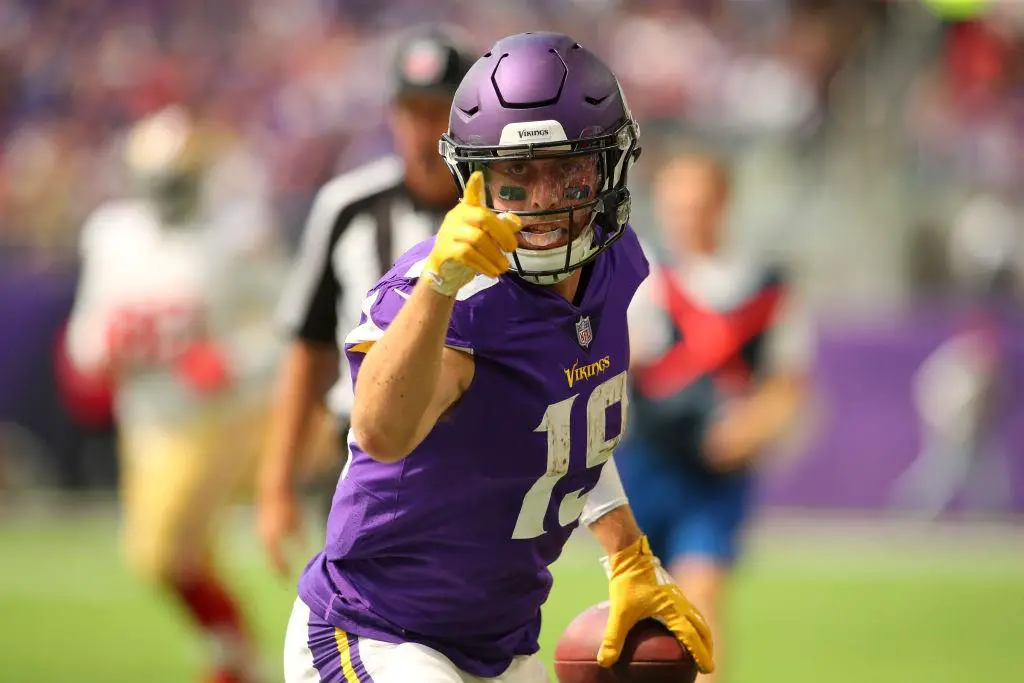 Adam Thielen pointing for a first down after a catch