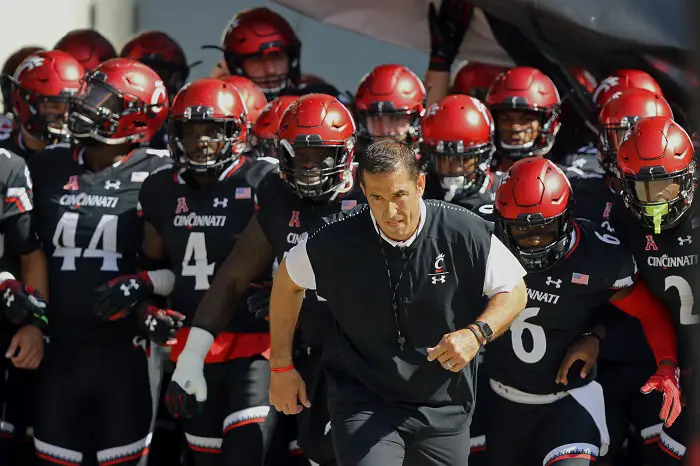 Cincinnati Bearcats head coach Luke Fickell stands with his team prior to the game against the Tulane Green Wave at Nippert Stadium.