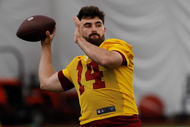 Sam Howell throwing a football in Washington Commanders training camp.