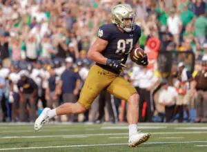 Notre Dame's Michael Mayer runs with the football