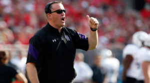 Pat Fitzgerald patrols the sideline on the road