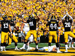 Iowa defensive players celebrate a safety during a game in 2021.