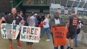 Browns Fans With Shirts and Signs