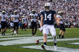 Sean Clifford runs into the end zone for a touchdown in 2021.