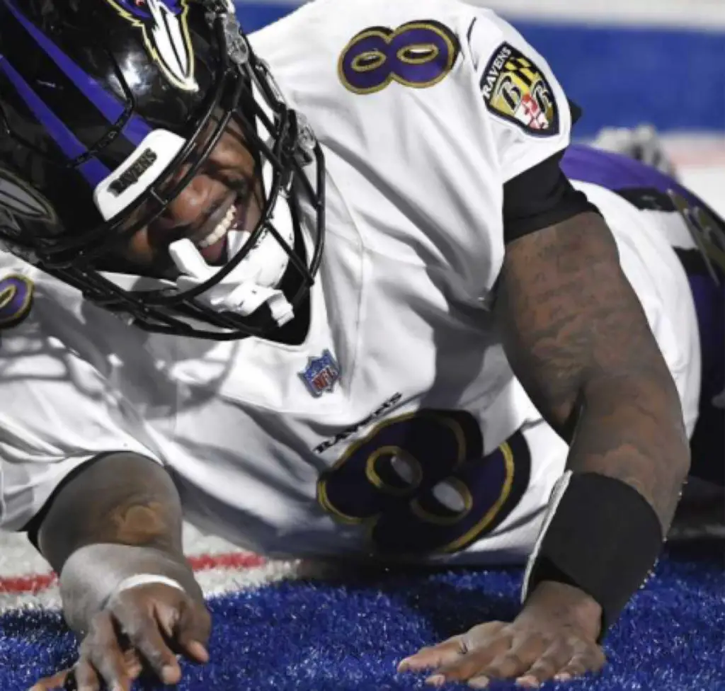 Lamar lies concussed and injured in loss to Bills 17-3 in 2021 Divisional playoffs.