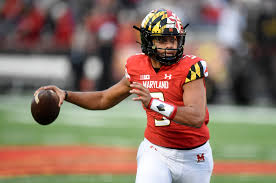 Taulia Tagovailoa rolls out to throw a pass in 2021.