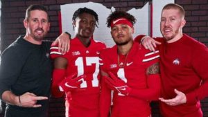 Brandon Inniss and Carnell Tate pose for a picture with Buckeye Wr Coach Brian Hartline.
