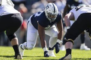 Penn State Nittany Lions DT PJ Mustipher lines up.