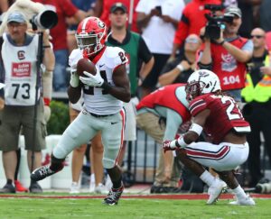 Safety Malaki Starks intercepts ball versus South Carolina for his second pick of the young season