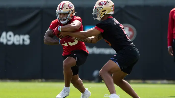 San Francisco Halfback Elijah Mitchell and QB Trey Lance