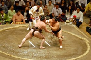 sumo wrestlers competing