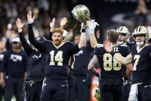 New Orleans Saints quarterback Andy Dalton celebrates as his team earns the victory over the Seattle Seahawks.